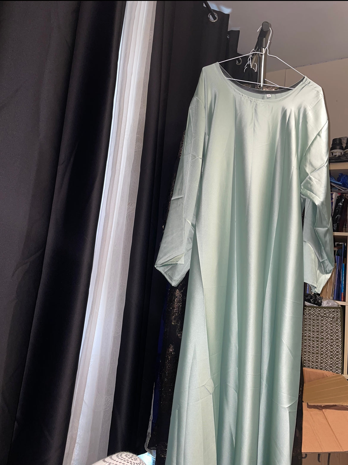 An open fransawi dress in sage gereen