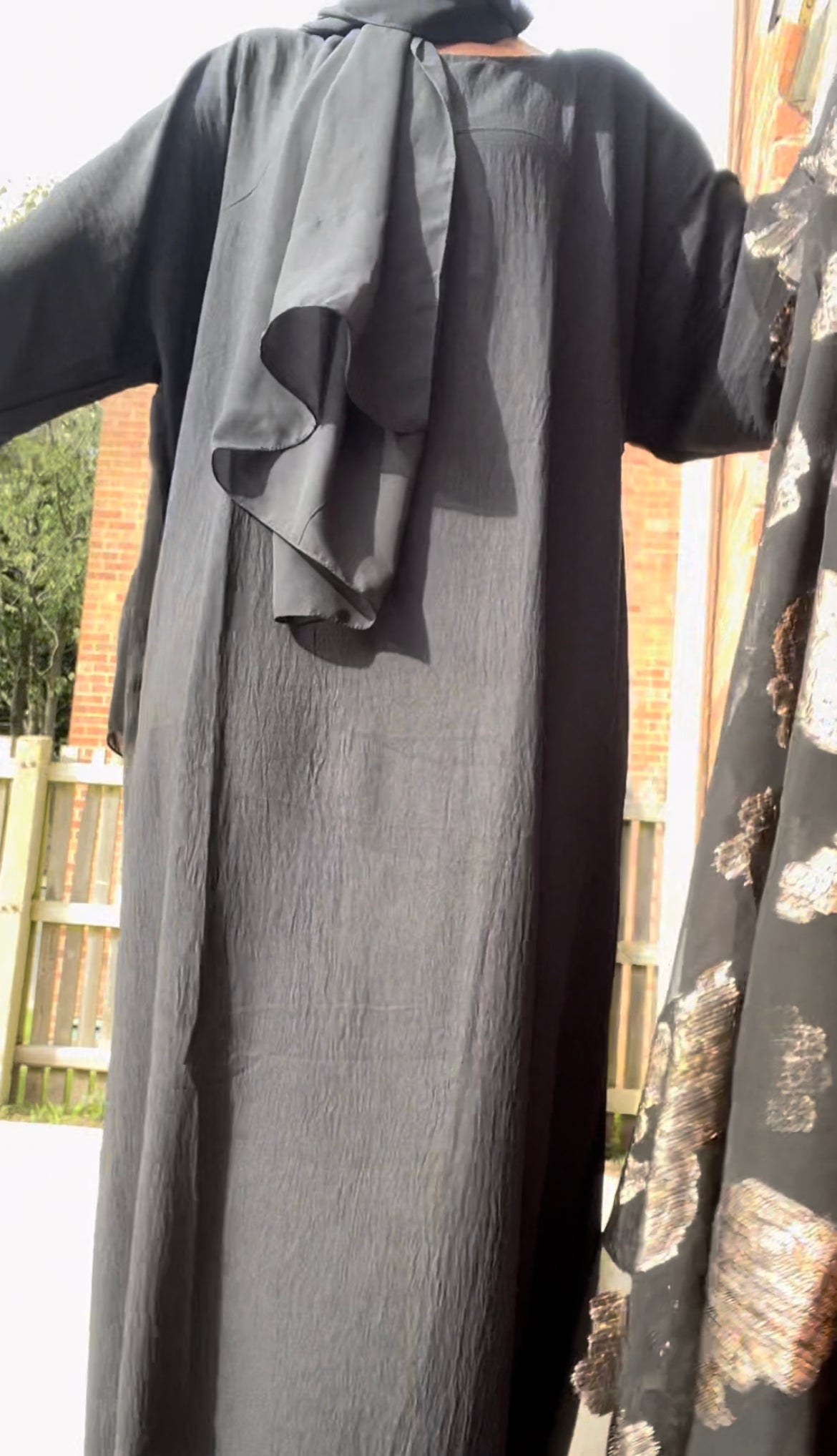 An open Fransawi dress in Black