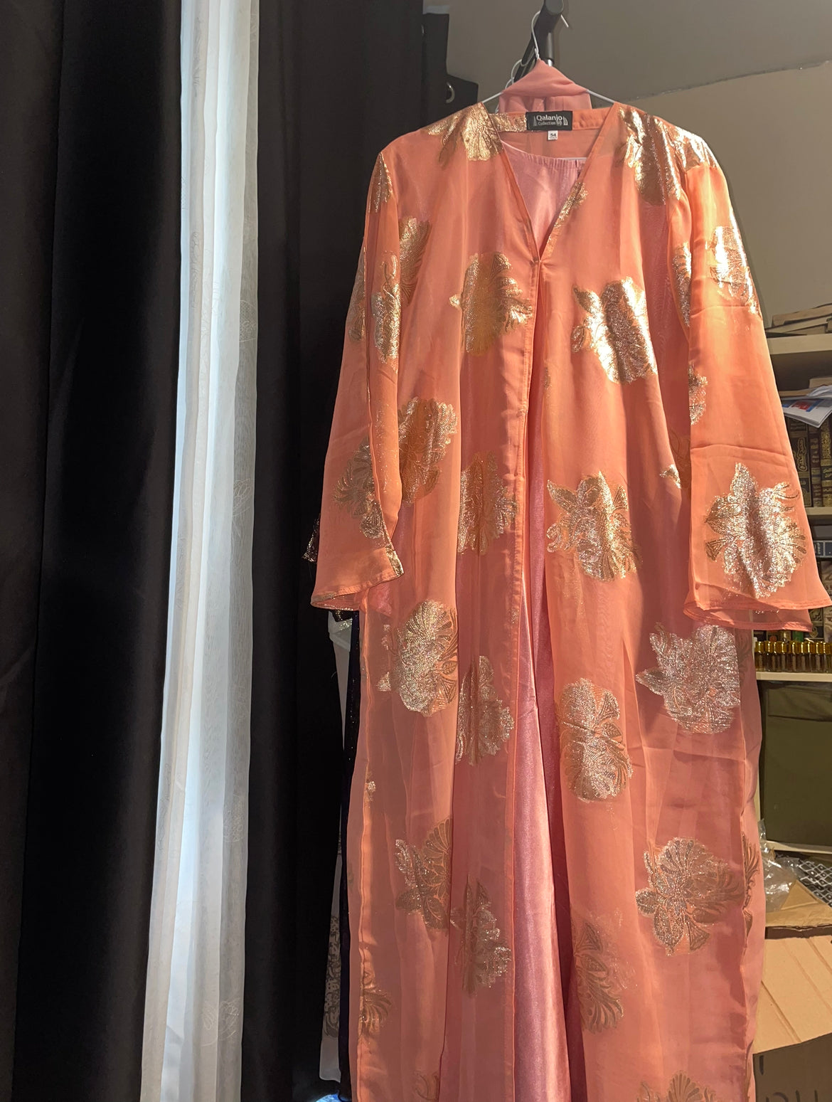 An open fransawi dress in pastel orange